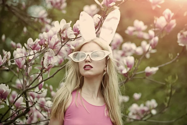 Sensual woman in magnolia bloom.