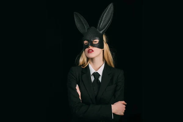 Easter bunny woman. Egg hunt. Woman rabbit easter bunny girl. Blonde woman in rabbit bunny ears. Closeup of winking bunny girl face. Rabbit woman wearing ears.