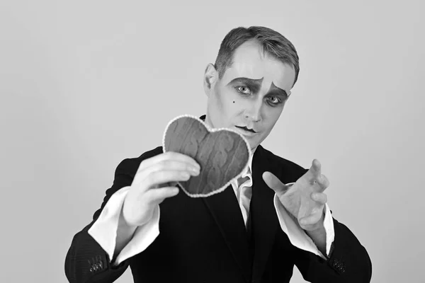 He is sensitive and very poetic. Mime man hold red heart for valentines day. Theatre actor pantomime falling in love. Mime actor with love symbol. Love confession on valentines day — Stock Photo, Image