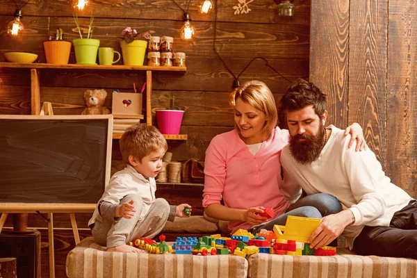Home schooling concept. Little child with family on home schooling. Son with mother and father play on home schooling. Home schooling for children