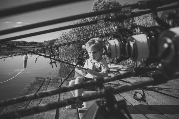 Handsome young kid hold fishing rod — Stock Photo, Image