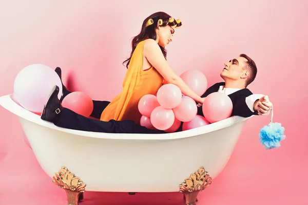 Important part of life. Bubble bath day. Beauty routine and personal hygiene. Hair grooming routine. Bathing hygiene habit. Couple in love in bath tub. Couple of mime man and sexy woman enjoy bathing