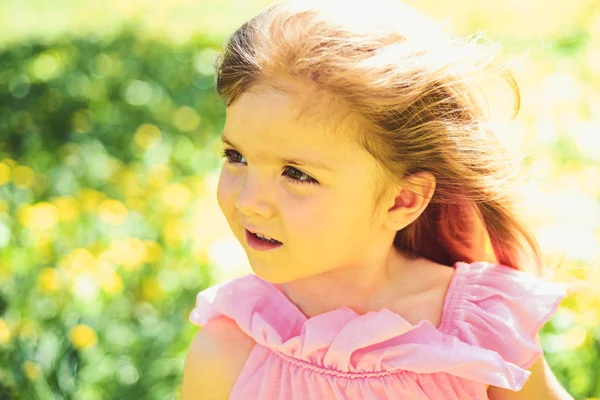 Spring is in my heart. Summer girl fashion. Happy childhood. Springtime. weather forecast. face skincare. allergy to flowers. Small child. Natural beauty. Childrens day. Little girl in sunny spring — Stock Photo, Image