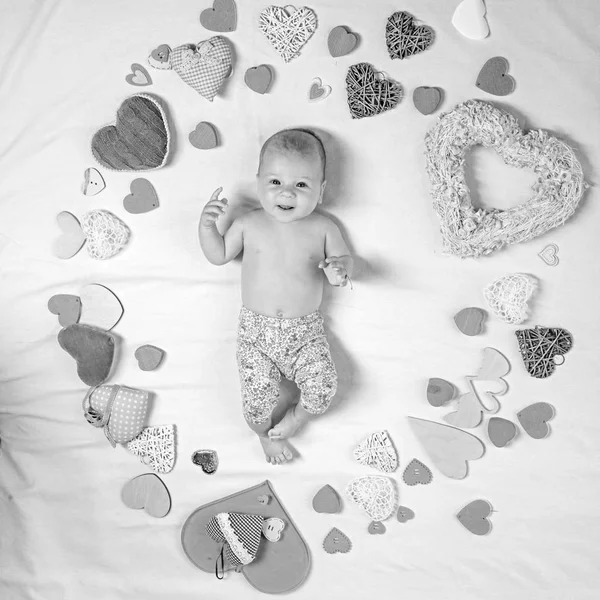I love you. Family. Child care. Sweet little baby. New life and birth. Love. Portrait of happy little child. Small girl among red hearts. Childhood happiness.Valentines day — Stock Photo, Image