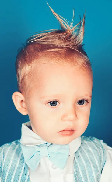 Getting your styled hair to last all day. Small boy with stylish haircut. Boy child with stylish blond hair. Small child with messy top haircut. Healthy hair care habits. Hair styling products