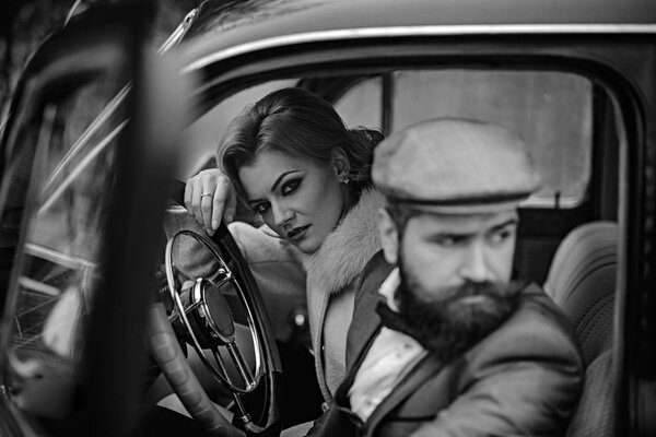 Travel and business trip or hitch hiking. travel in winter of sexy woman and bearded man.