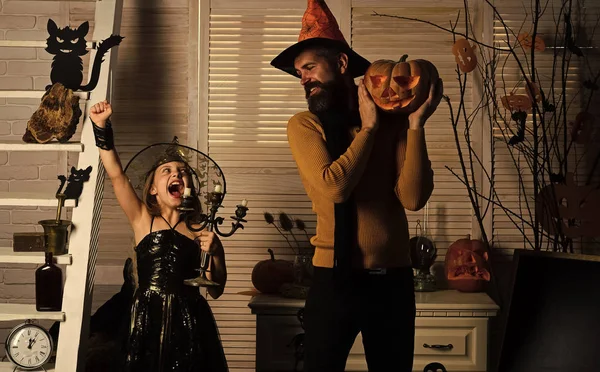 Halloween party concept. Girl and bearded man with winning faces — Stock Photo, Image