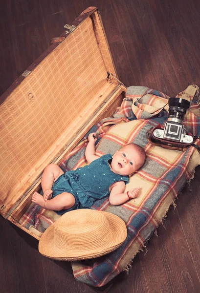 Interesting story. Sweet little baby. New life and birth. Small girl in suitcase. Traveling and adventure. Family. Child care. Portrait of happy little child. Childhood happiness. Photo journalist — Stock Photo, Image