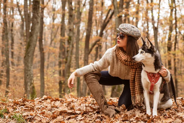 Animal husbandry. Girl pretty stylish woman walking with husky dog autumn forest. Unconditional love. Pedigree dog concept. Girl enjoy walk with husky dog. Best friends. Siberian husky favorite pet