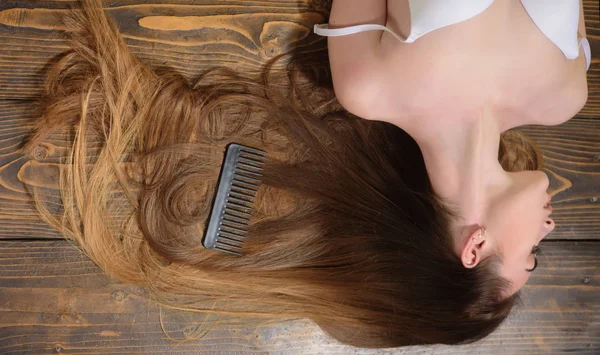 Long healthy hair. Woman with beautiful long hair on wooden background. Long hair. Fashion haircut. — Stock Photo, Image