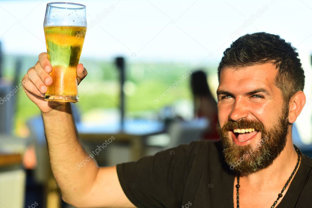 Beard man drinking beer from a beer mug. Man drinking beer. Man with beer.