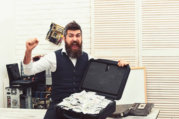 Its a rich mans world. Business man with money case in office. Bearded man with cash money. Bearded hipster with dollar banknotes. Business and making money. Withdrawing cash from electronic money