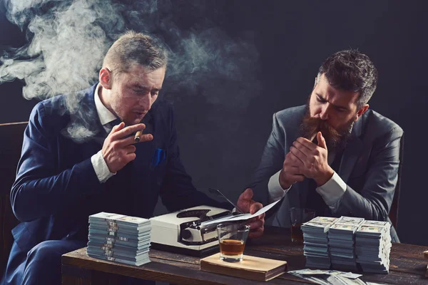 Busy working in office. Successful investment in business. Money brokers counting profit increase. Business partners with cash money. Businessmen write financial report while drinking and smoking — Stock Photo, Image