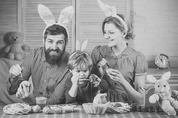 Easter, mother, father and child in bunny ears.