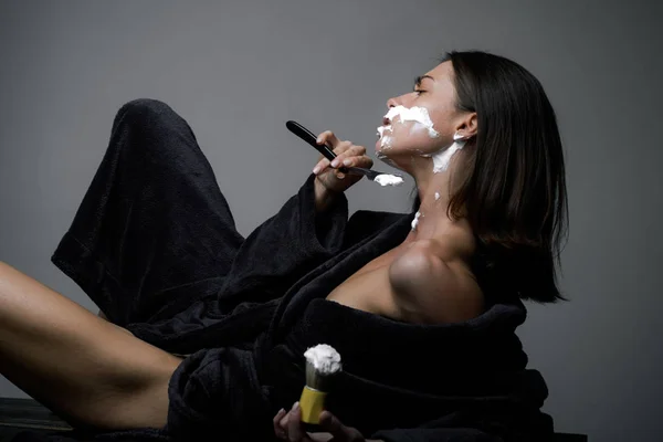 Woman power and feminism concept. The struggle for gender equality. Dominancy of women over men. Matriarchy. Feminism. Sexy woman shaving. — 스톡 사진