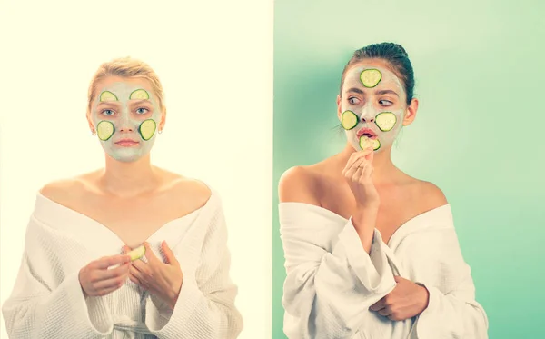 Spa and beauty care. Girls friends sisters in bathrobes making clay facial mask. Anti age care. Stay beautiful. Skin care for all ages. Women having fun skin mask. Pure beauty. Beauty product