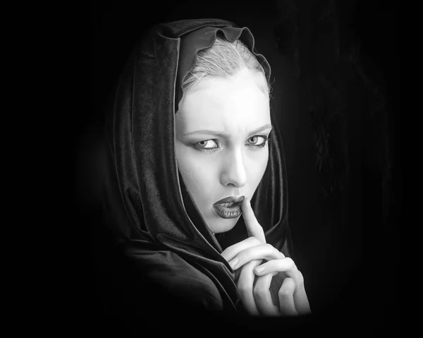 Woman in black hood - gothic style. fashion photo