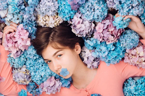girl with summer makeup. Makeup cosmetics and skincare. Spring woman with hydrangea flowers. Summer beauty. Fashion portrait of woman. Healthy hair and skin. womens day