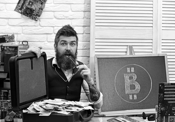 Beyond his wildest imagination. Bearded hipster with bitcoin symbol and dollars. Business man in server room. Bearded man with cash money. Bitcoin for business. From paper money to crypto currency