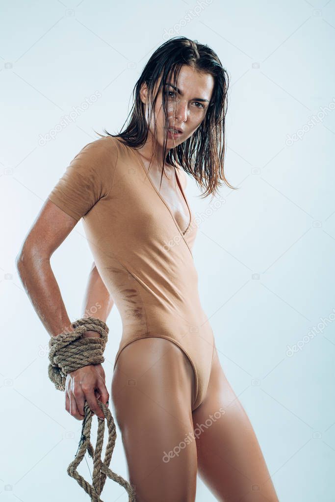 The beauty of tight binding. Sexy woman with artistic wrists binding. Erotic woman with rope binding. Binding decoratively