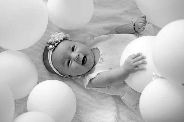 Pure beauty. Small girl. Happy birthday. Portrait of happy little child in white balloons. Sweet little baby. New life and birth. Childhood happiness. Family. Child care. Childrens day — Stock Photo, Image