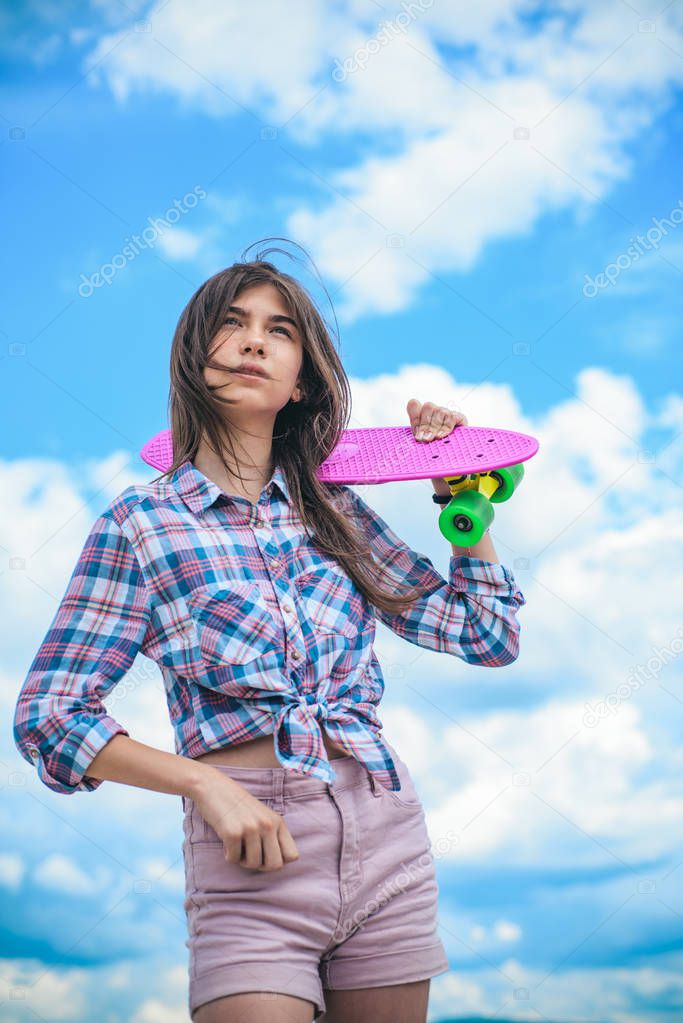 Urban scene, city life. ready to ride on the street. skateboard sport hobby. Summer activity. Hipster girl with penny board. plastic mini cruiser board. Spring. They know how to skate