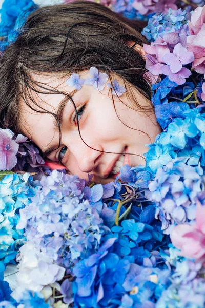 Summer beauty. Makeup cosmetics and skincare. Fashion portrait of woman. Healthy hair and skin. girl with summer makeup. Spring woman with hydrangea flowers. Spring collection