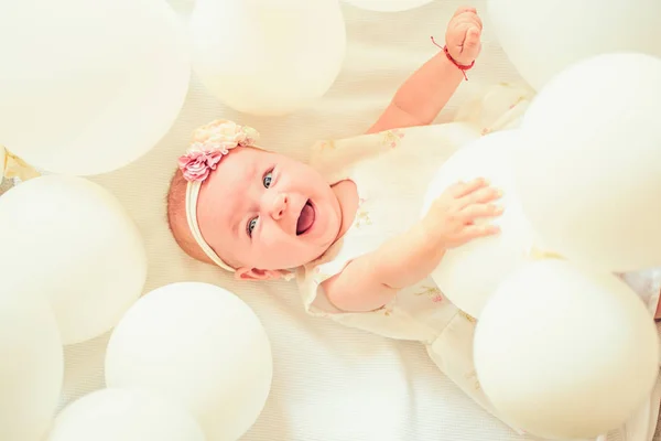 Only fresh and healthy food for my baby. Sweet little baby. New life and birth. Small girl. Happy birthday. Family. Child care. Childrens day. Portrait of happy little child in white balloons