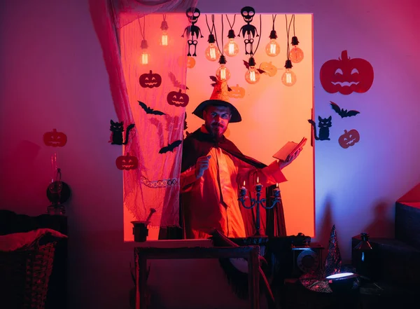 Halloween man with pumpkin in darkness. Magic, enchantment, witchcraft. Halloween, holidays celebration. — Stock Photo, Image