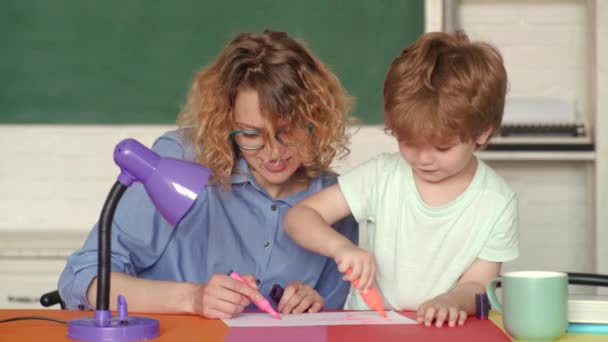 Pupil learning letters and numbers - mathematics concept. School community partnership. Educational process. Happy family - mother and son from elementary school. — Stock Video