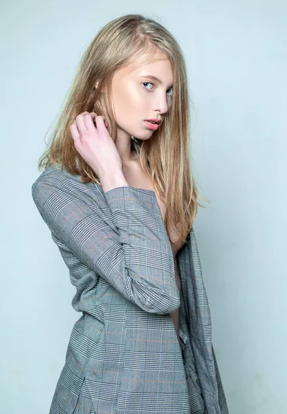 Skincare. vintage look. retro beautiful girl with long hair. natural makeup. beauty and elegance. jazz step style. british fashion. checkered jacket. elegant woman in formal male suit. skin care — Stock Photo, Image