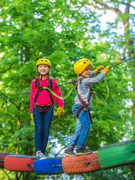 Helmet and safety equipment. Eco Resort Activities. Artworks depict games at eco resort which includes flying fox or spider net. Children summer activities.