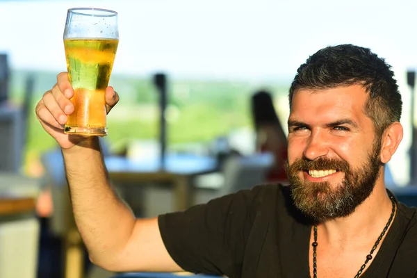 Retro man with a beer. Happy elegant man drinking beer. Senior man drinking beer with surprise face.