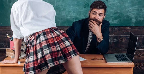 Man bearded teacher and female mini skirt sexy legs. Erotic lesson concept. Subordinate and submission. Desirable sexy student. Sex education for all ages. Curious sexy learner. Sex role game — Stock Photo, Image