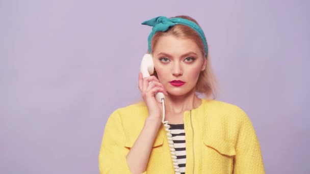 Portrait Of Female Customer Services Agent Working In Call Center. Pinup Girl with retro phone. — Stock Video