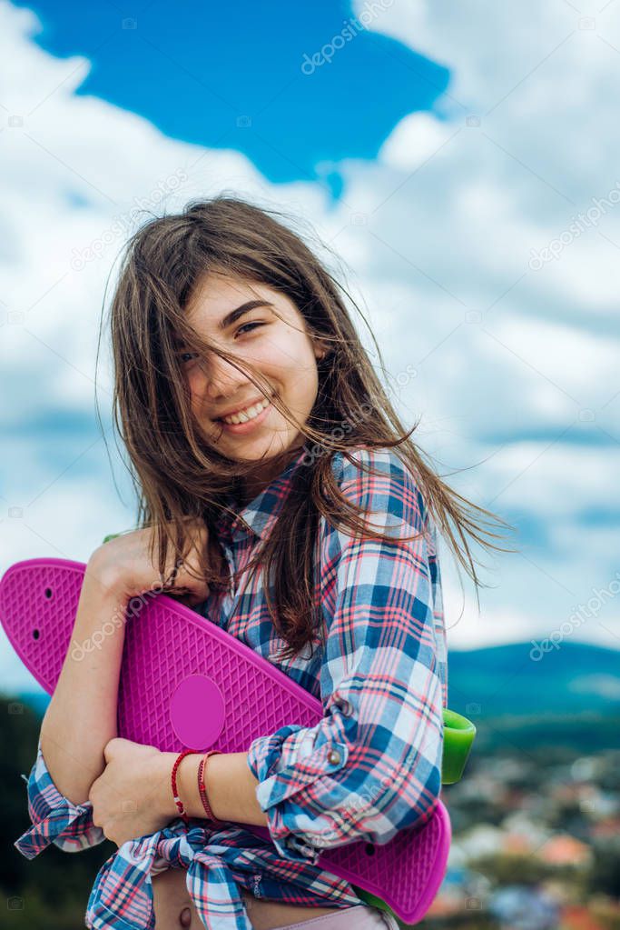skateboard sport hobby. Summer activity. Hipster girl with penny board. Urban scene, city life. plastic mini cruiser board. Spring. ready to ride on the street. happy girl. Feeling free and happy