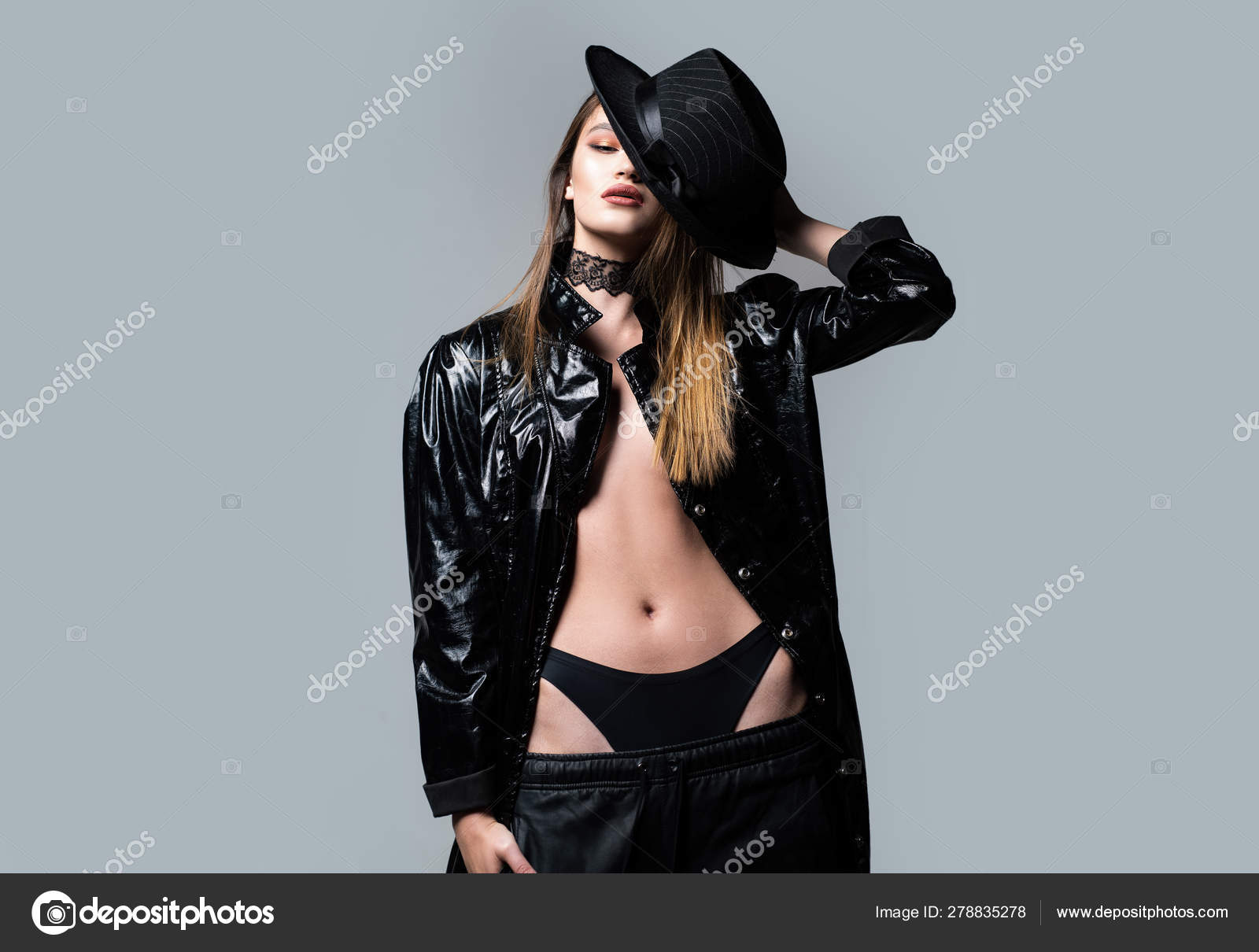 Temptation. woman in black latex leather coat. Beauty and fashion. Sensual woman. makeup and hair style. Temptation. woman in black latex leather coat. Beauty and fashion. Sensual woman. makeup and hair style.