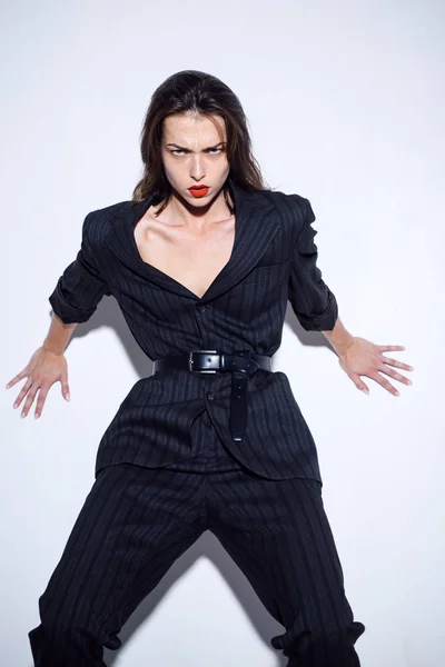 Woman power and feminism concept. Matriarchy. Feminism. Sexy woman with red lips in suit.