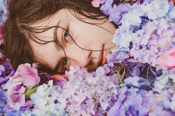 Spring woman with hydrangea flowers. Makeup cosmetics and skincare. Summer beauty. Fashion portrait of woman. Healthy hair and skin. girl with summer makeup. Hot day