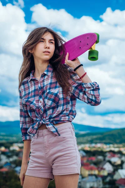 skateboard sport hobby. Summer activity. Urban scene, city life. plastic mini cruiser board. Spring. ready to ride on the street. Hipster girl with penny board. Skater crew