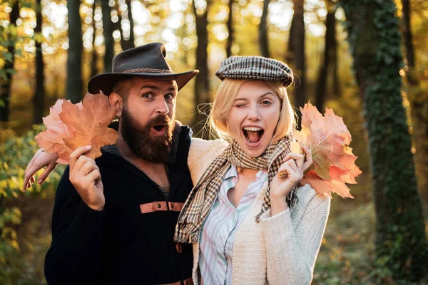 Young couple with autumnal mood. Passion dating and love. Outdoor Autumn atmospheric moments and dream. Autumn fashion portrait of couple with autumnal mood. Romantic couple.