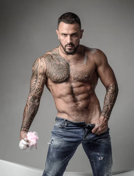 Enjoying morning routine. brutal sportsman washing in bath. steroids. sexy tattoo man hold sponge with soap foam. sport and fitness. muscular macho man with athletic body. Ready for morning shower — Stock Photo, Image