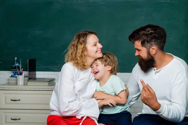 Young couple helping his son to make homework. First day at school. Little ready to study. First time to school. Children Education and Pupils Education. — Stock Photo, Image