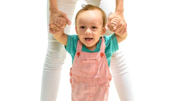 Propping him up. Toddler stage of development. Small child walking with help, motor skills. Little boy child develop gross motor activity. Adorable small toddler. Cute little baby learn to walk — Stock Photo, Image