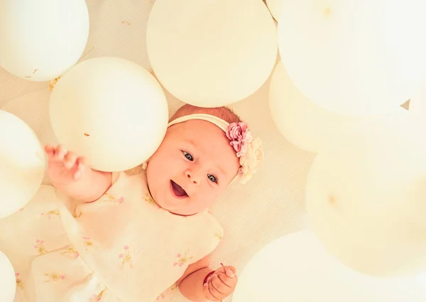 This is my baby. Sweet little baby. New life and birth. Childhood happiness. Small girl. Happy birthday. Family. Child care. Childrens day. Portrait of happy little child in white balloons