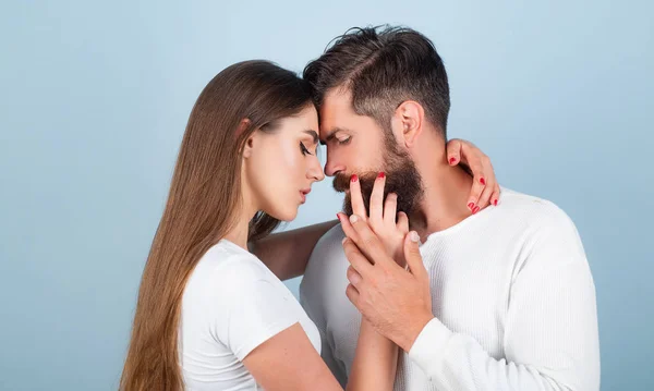 Loving man caressing hugging kissing woman. Enjoying tender warm pleasant moment of love. Beautiful young couple waiting to kiss. Love story or portrait couple in love. — Stock Photo, Image