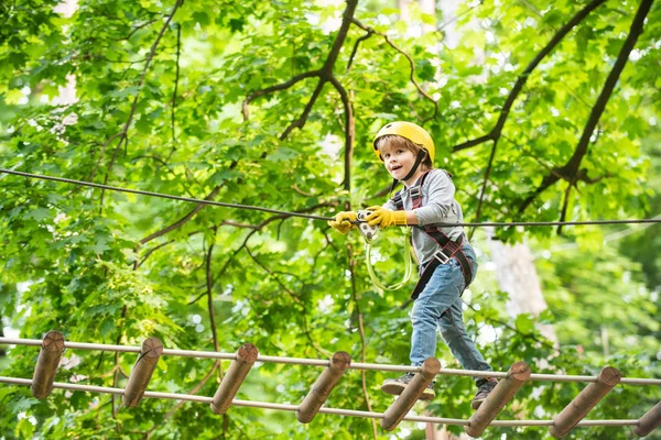 Rope park - climbing center. Child boy having fun at adventure park. Go Ape Adventure. Child boy having fun at adventure park — Stock Photo, Image