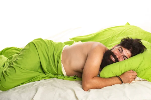 Young man sleeping in bed with pillows at home. Handsome man in bed. sleeper. Wake up Sleepy. — Stock Photo, Image