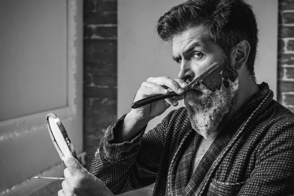 Barber Shop Studios.Sandalwood shaving cream. Hair Preparation is just for the dashing chap. Moustache Wax. Hair salon and barber vintage. Barbershop vintage. He is doing styling with the shaver.