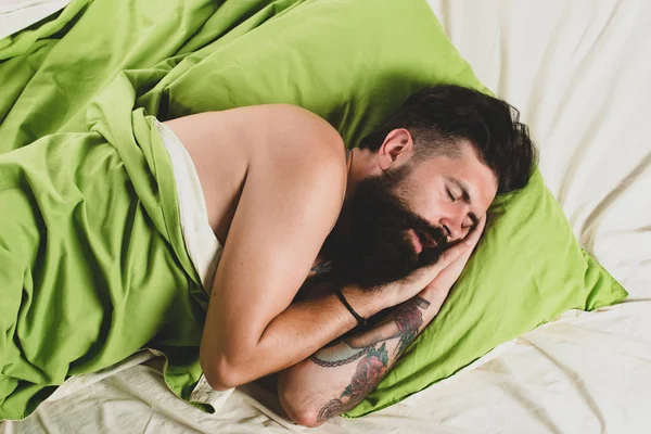 Man sleep on bed with very deep sleep. Man lying in bed and sleeping. Young man sleeping in bed with pillows at home. sleeper. — Stock Photo, Image